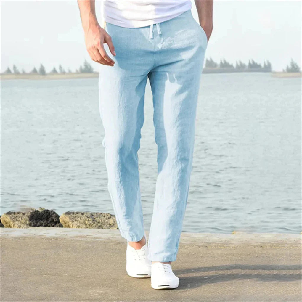 Light blue men's linen summer pants, relaxed fit, breathable, perfect for casual warm weather style.