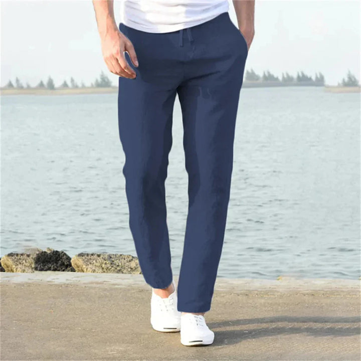 Versatile men's linen summer pants, ideal for warm weather casual outfits & relaxed style. Breathable & comfortable.