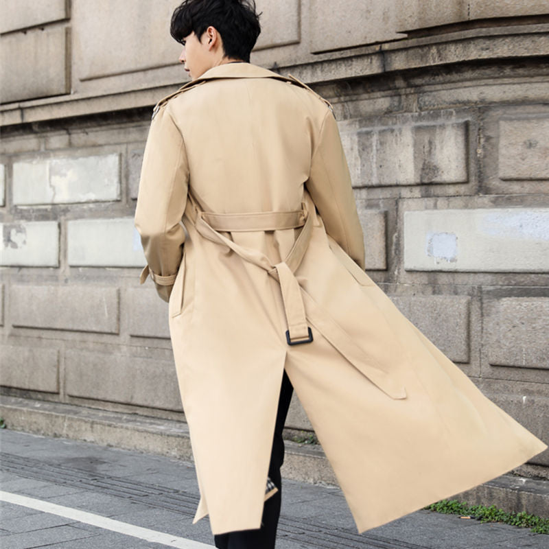 Sophisticated black men's double-breasted trench coat, long length with belted waist.