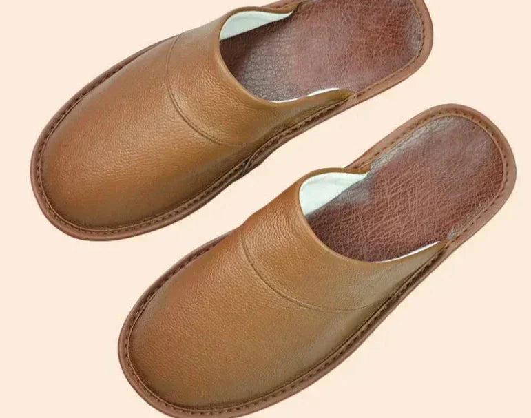 Casual men's leather slippers, ideal warm and cozy footwear for indoor lounging and comfort.