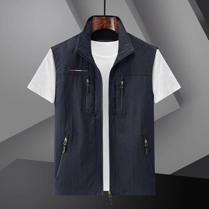 Men's multi-pocket utility travel vest for summer adventures. Breathable & lightweight for outdoor fishing & hiking.