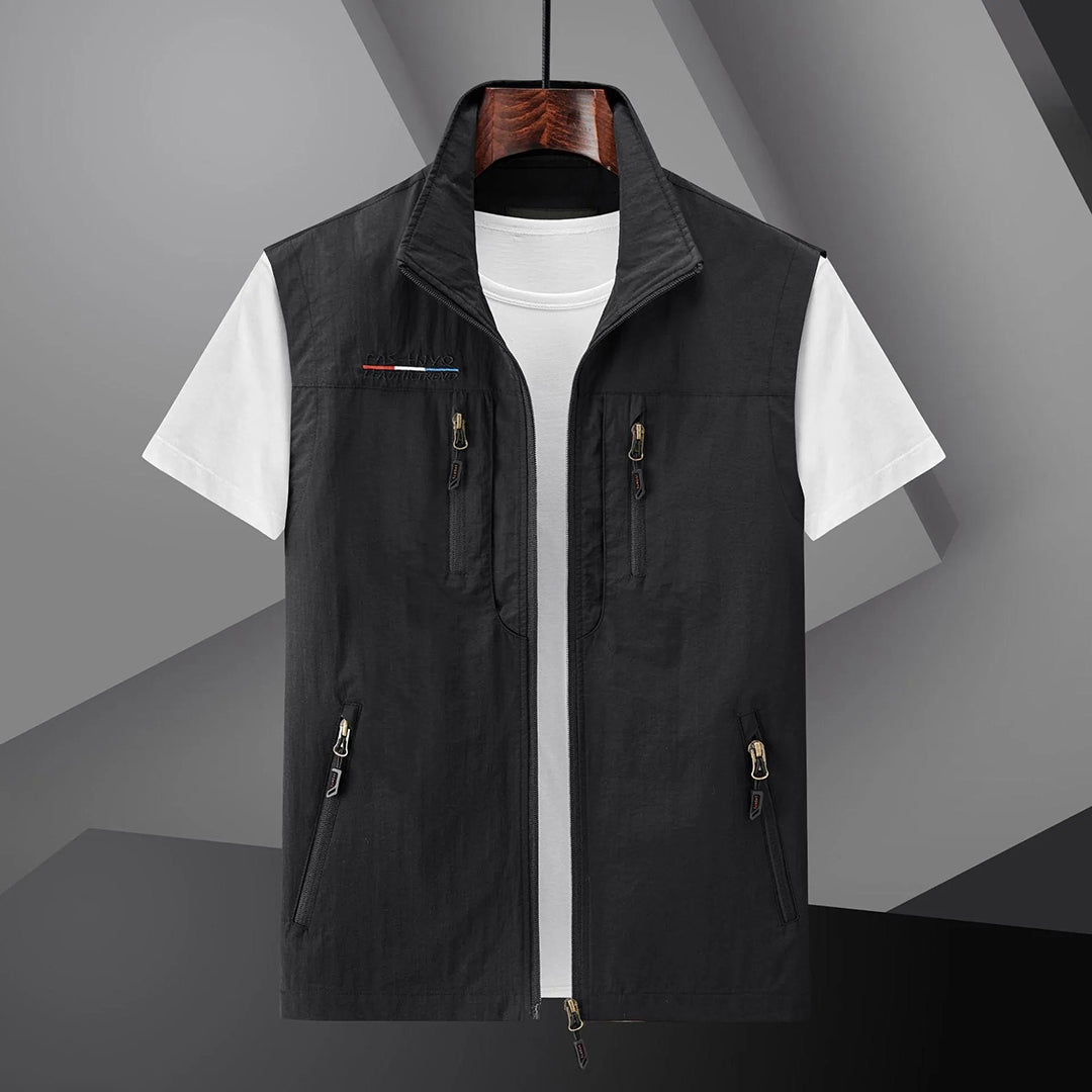 Close-up of men's multi-pocket utility vest, ideal for travel, fishing, hiking. Functional & lightweight design.