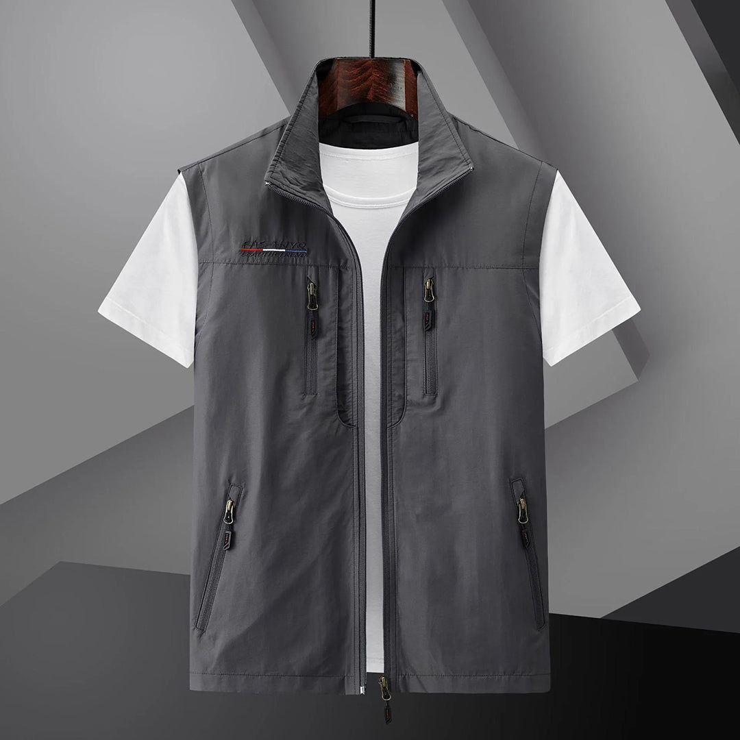 Man wearing a breathable men's multi-pocket utility vest, perfect for summer travel, fishing, and outdoor hiking.