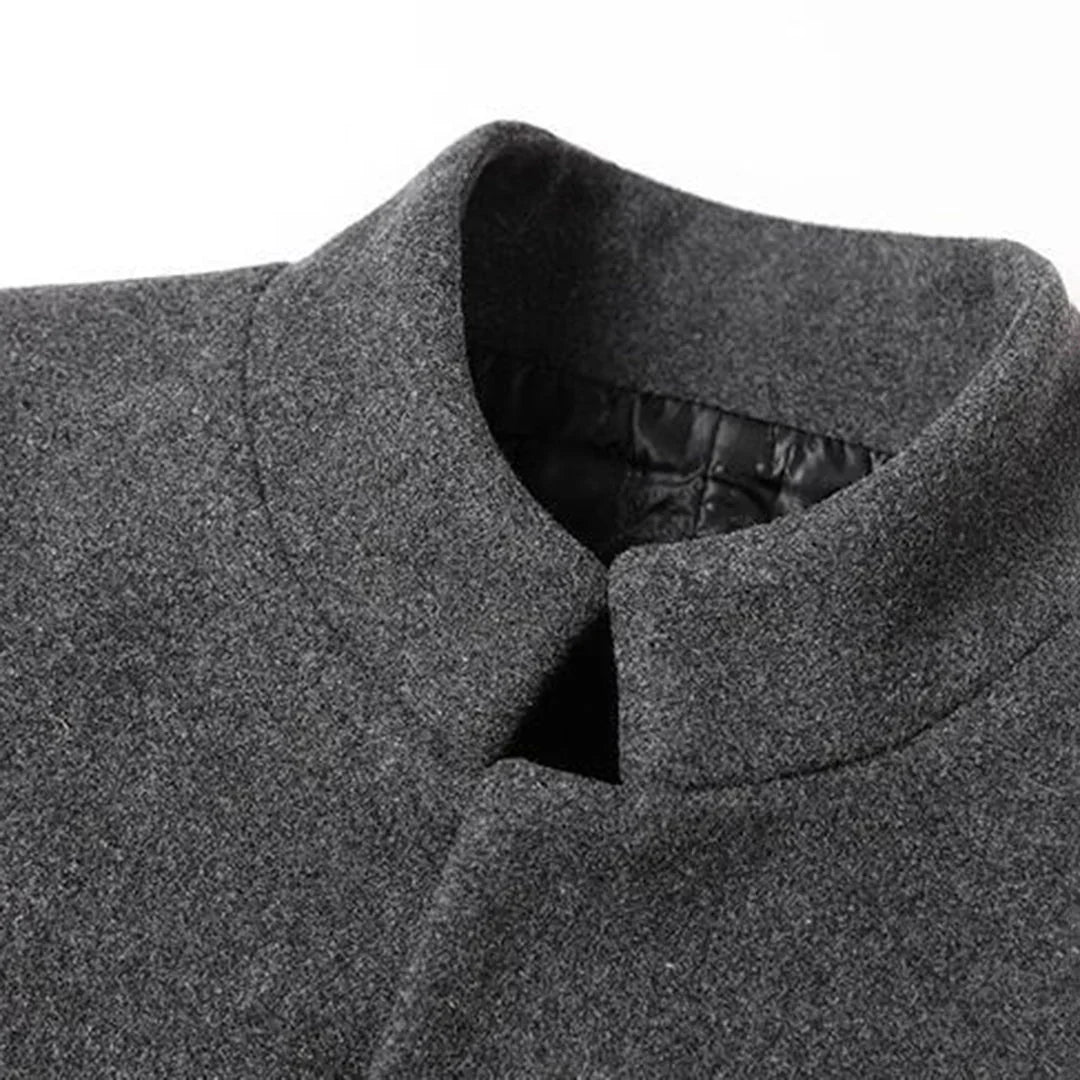 Warm men's formal long coat, ideal for winter. Shows a stylish man wearing the elegant button-down outerwear.