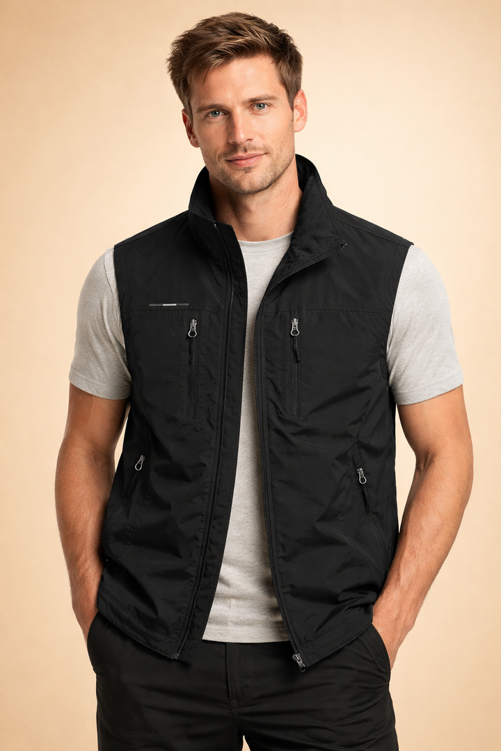 Grey men's outdoor utility vest featuring secure zipper pockets for ultimate storage & accessibility.