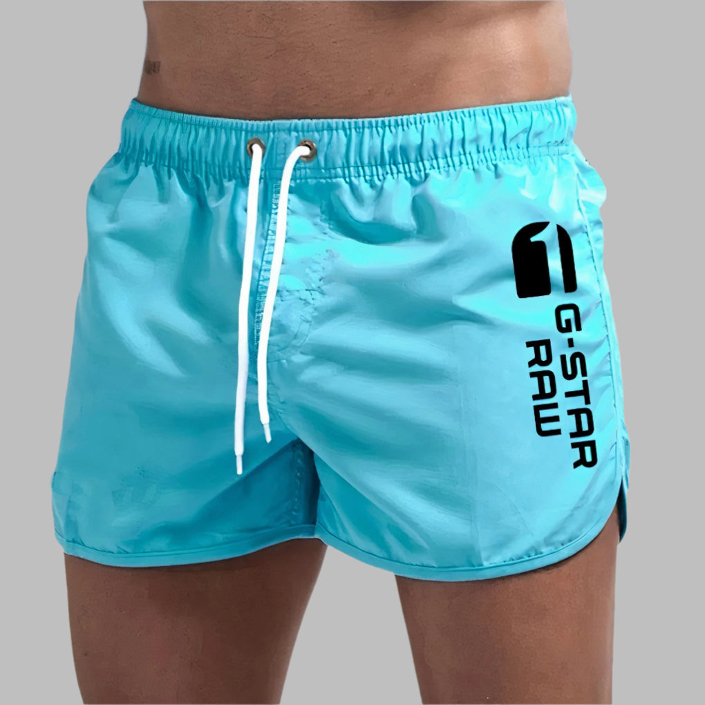 Men's quick-dry solid swim trunks. Lightweight and comfortable for beach, pool, or active summer wear.