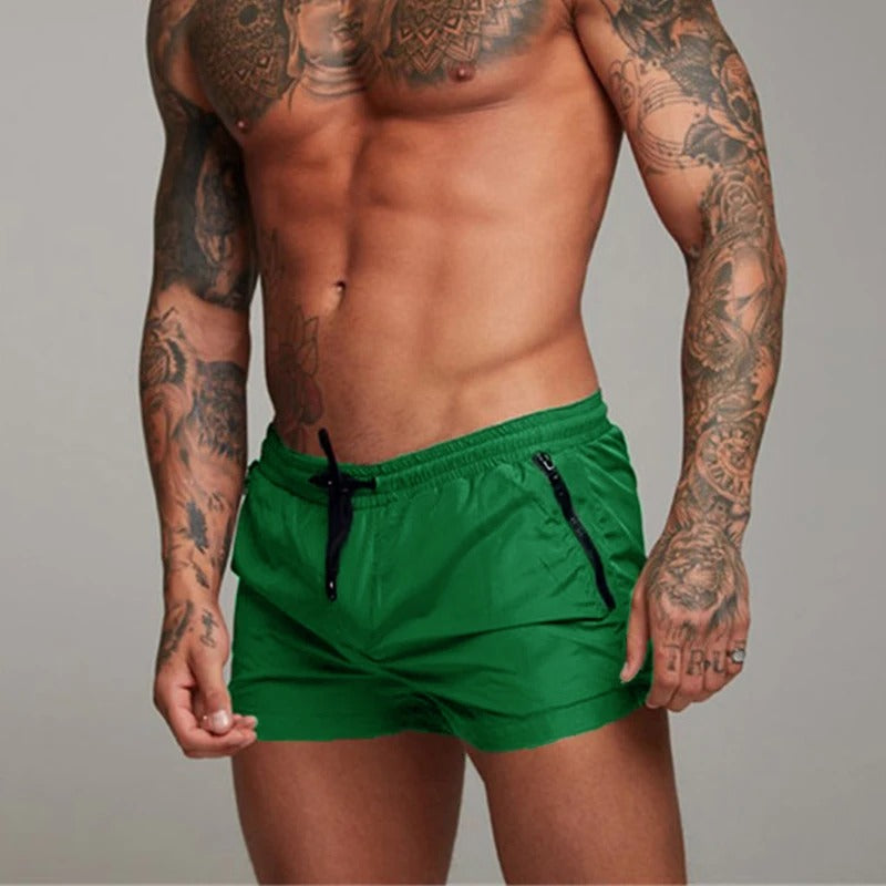 Performance men's quick dry swim trunks, ideal for swimming, beach, & athletic activities.