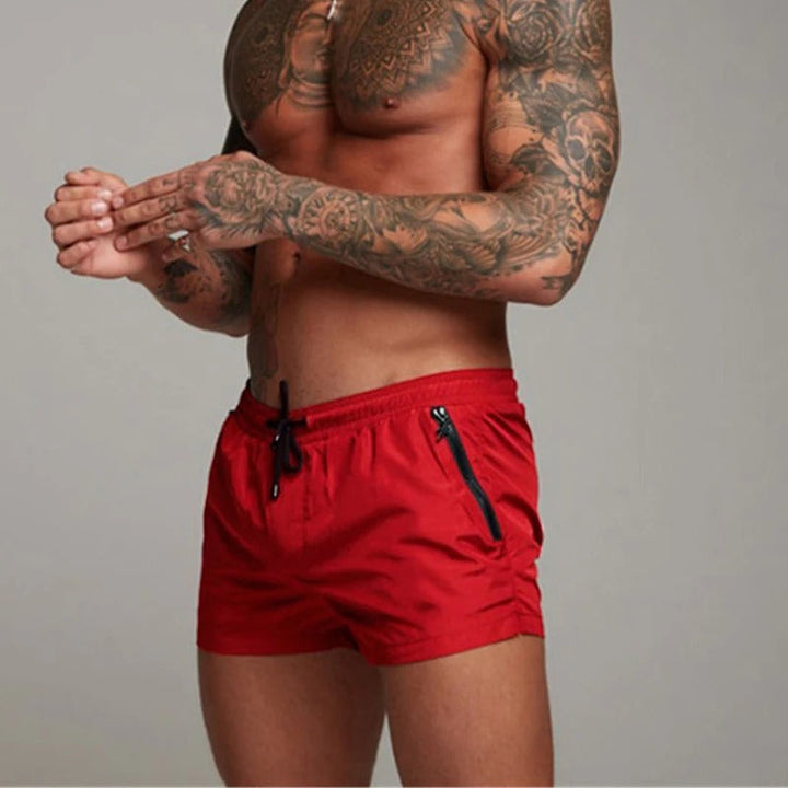 Men's stretchy quick-dry swim shorts with elastic waist, designed for ultimate comfort & style.