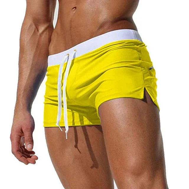 Quick-dry men's swim shorts, breathable beachwear perfect for pool or ocean activities. Summer fashion.