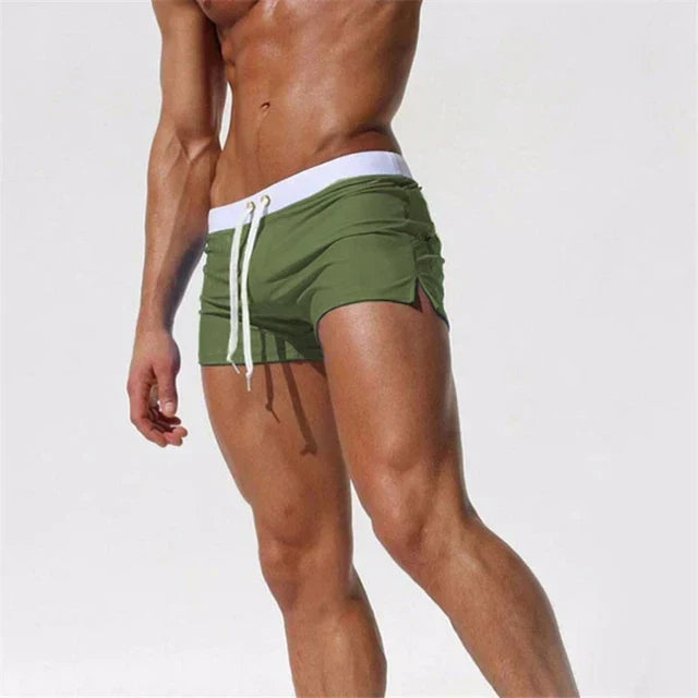 Stylish men's quick-dry swim shorts, a summer fashion essential for beach & pool. Comfortable swimwear.