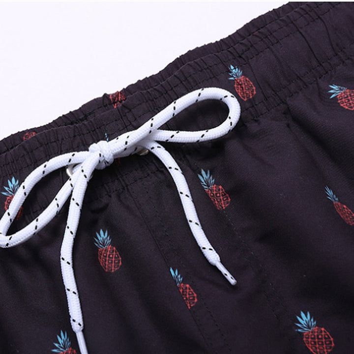Stylish men's swim shorts with quick-drying fabric, ideal for beach, pool, or vacation.