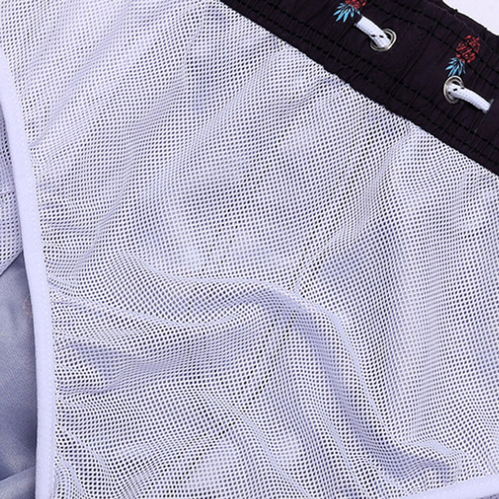 Vibrant men's quick-dry swimming shorts, essential beachwear for summer vacations.