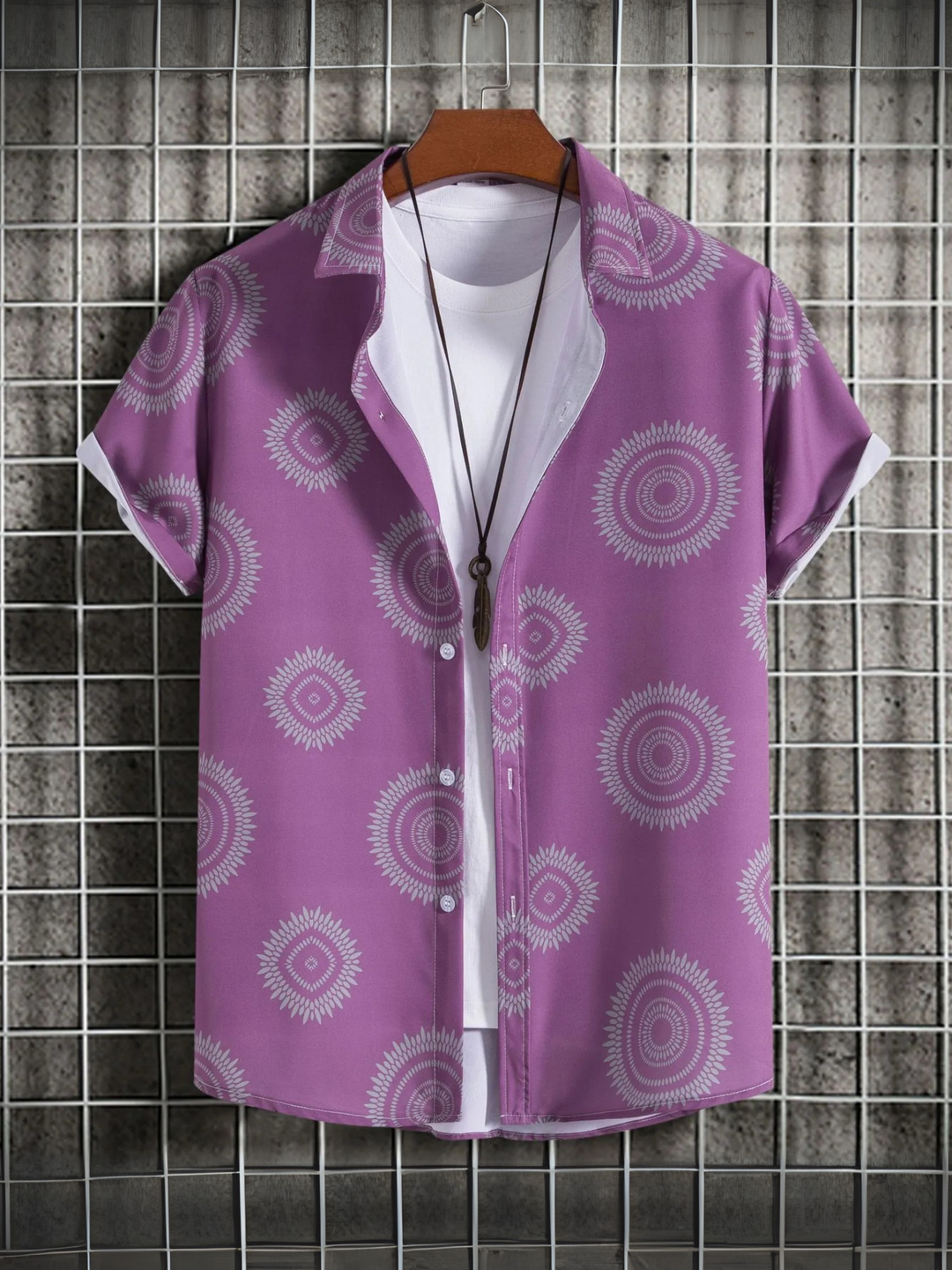 Stylish men's red-violet short-sleeve Hawaiian shirt with button-up front and all-over tropical pattern.