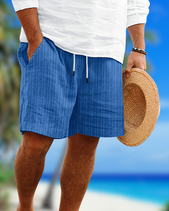 Close-up of men's comfortable relaxed fit drawstring shorts with an elastic waist and practical side pockets.