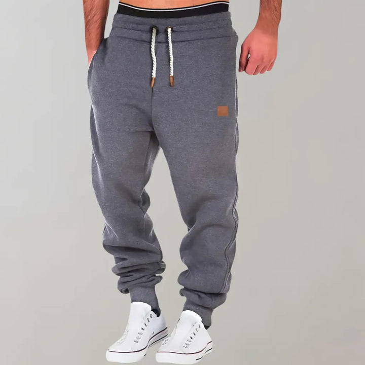 Comfortable men's track pants with a relaxed fit, great for everyday wear and casual fashion.