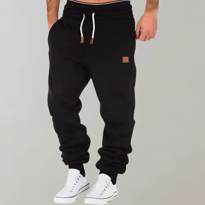 Versatile men's jogger pants featuring a relaxed fit for all-day comfort and athletic leisure.