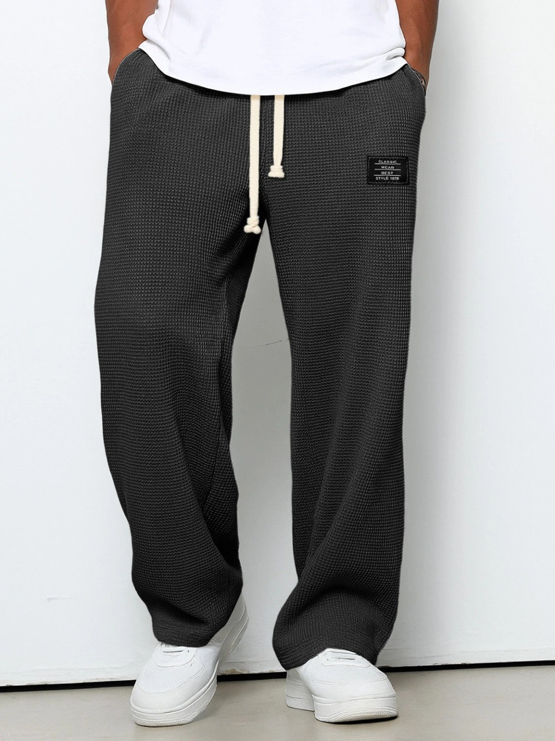 Modern men's activewear pants, relaxed fit joggers with tapered leg for ultimate comfort & style.