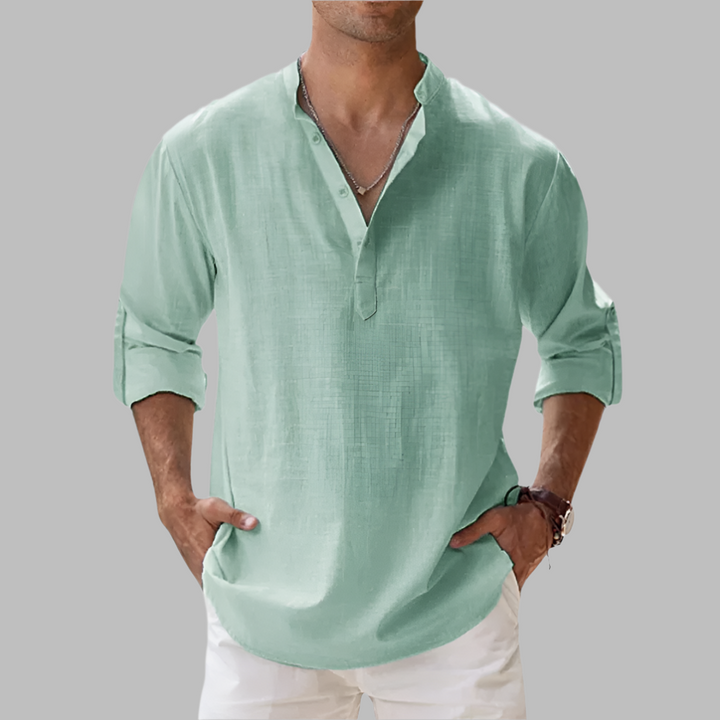 Breathable men's relaxed fit long sleeve summer button-down shirt, comfortable for warm weather & beach.