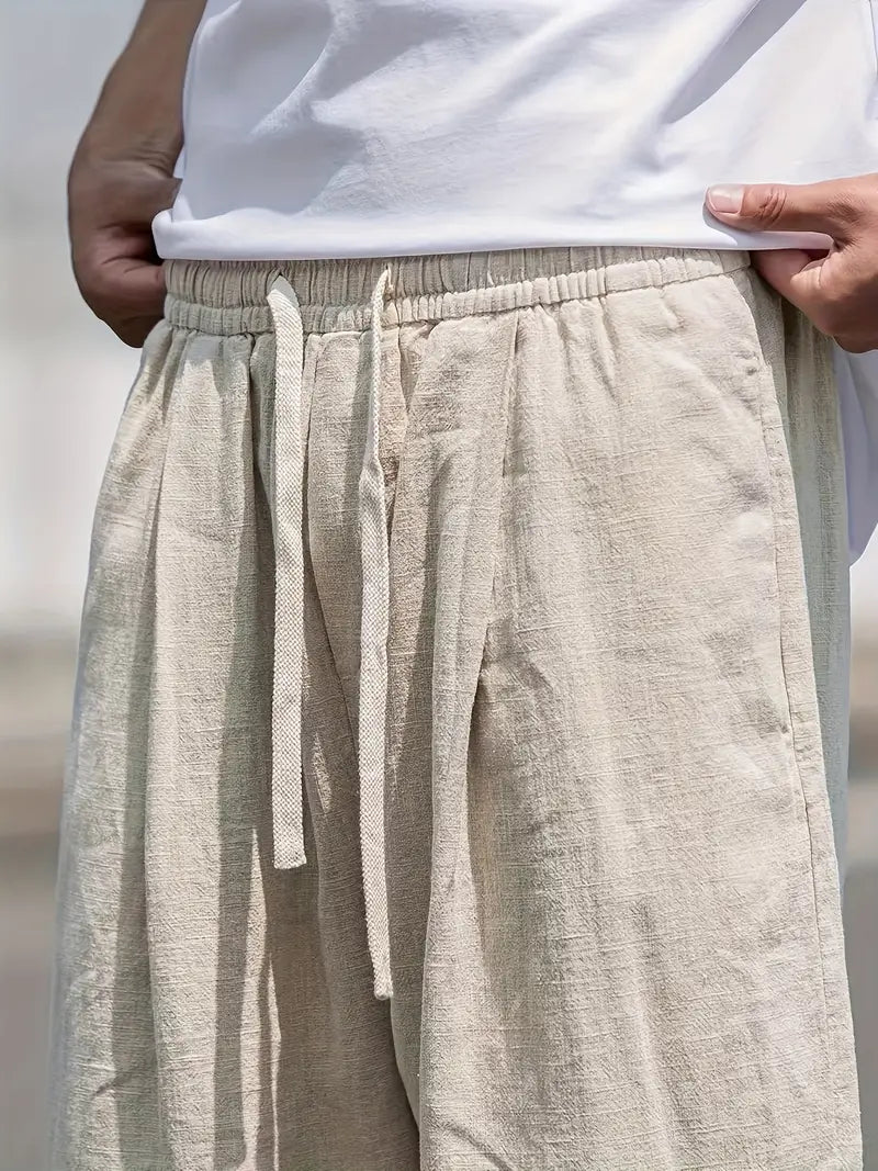 Khaki men's relaxed fit summer trousers, a stylish and comfortable choice for casual outings.