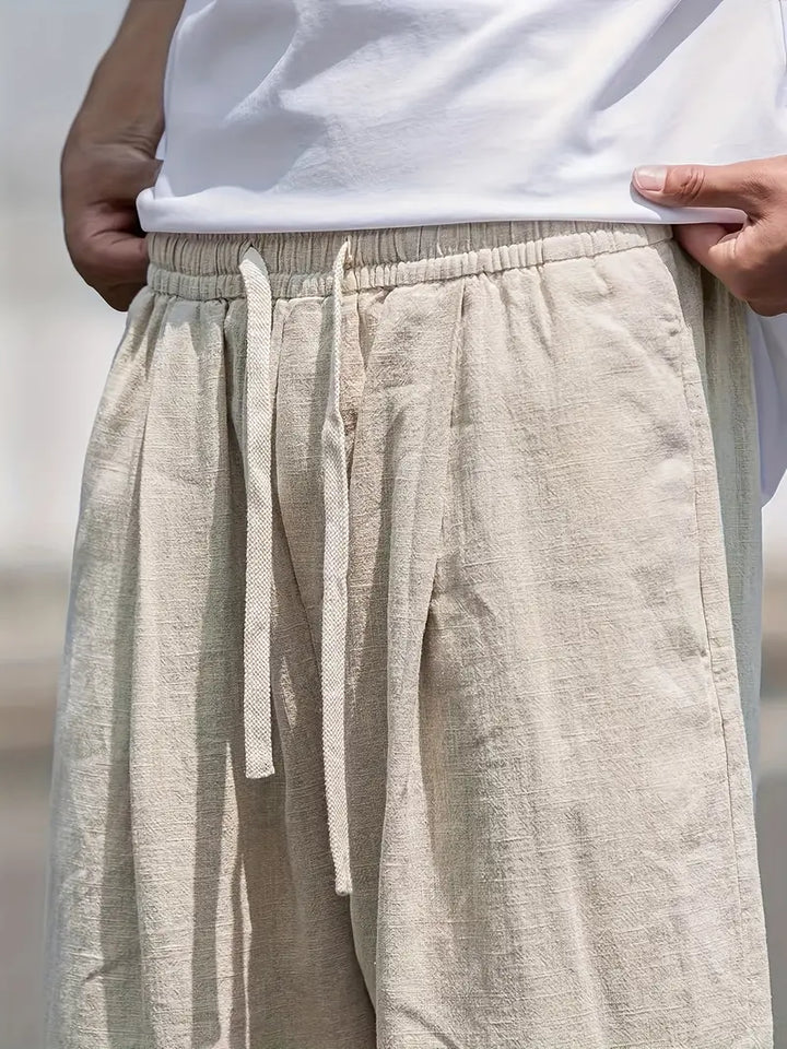 Khaki men's relaxed fit summer trousers, a stylish and comfortable choice for casual outings.