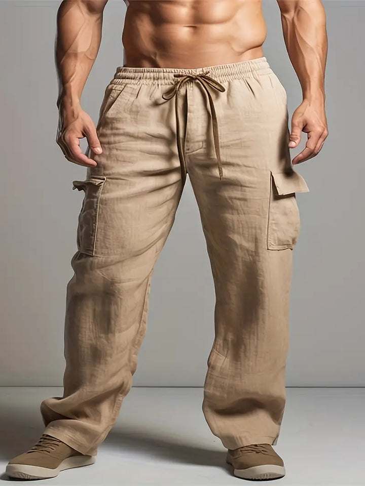 Close-up of versatile men's relaxed fit summer trousers, highlighting the lightweight fabric & smart casual design. Event wear.