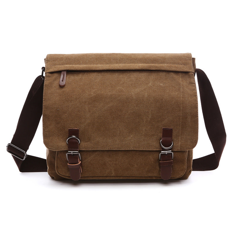 Durable men's canvas shoulder bag, versatile as a crossbody or travel bag. Rugged design for everyday use.