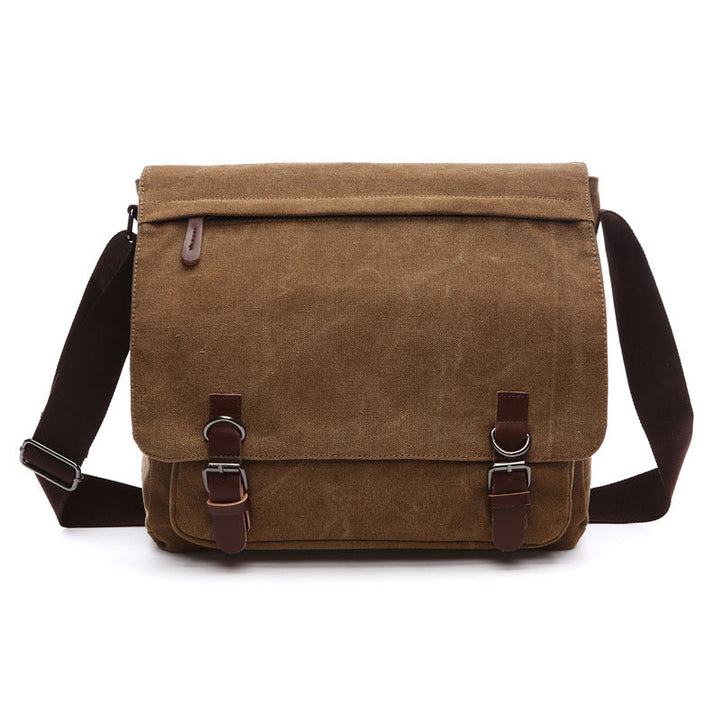 Durable men's canvas shoulder bag, versatile as a crossbody or travel bag. Rugged design for everyday use.