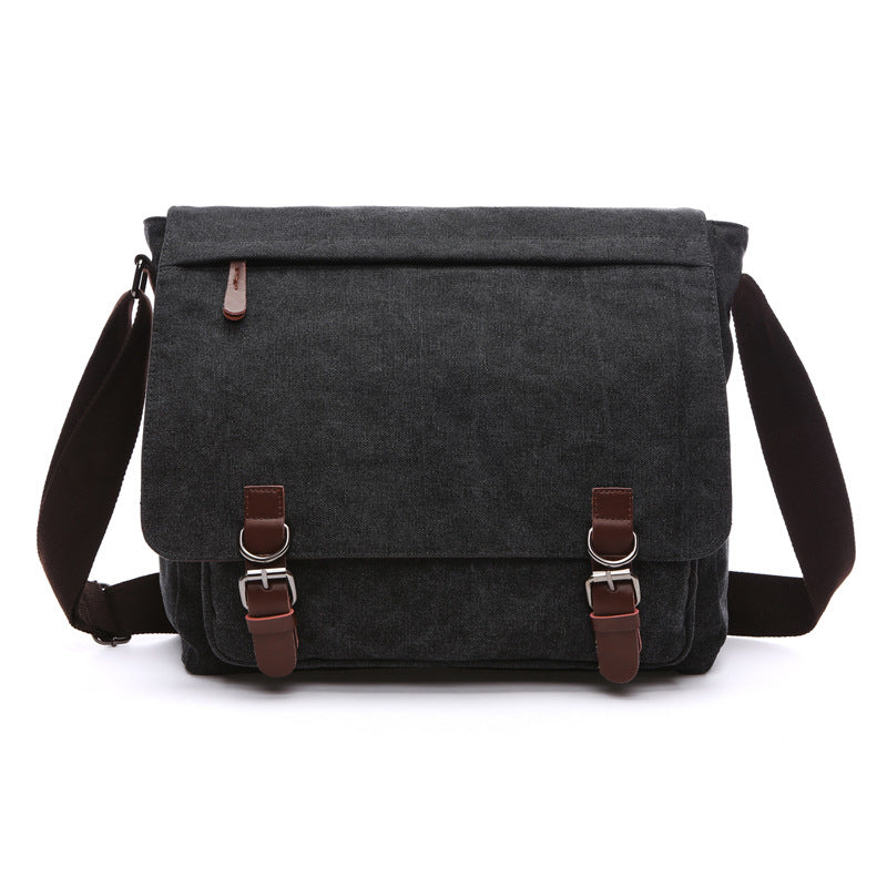 Close-up of a men's rugged canvas shoulder bag, showcasing textured fabric & secure buckles. Great for daily carry.