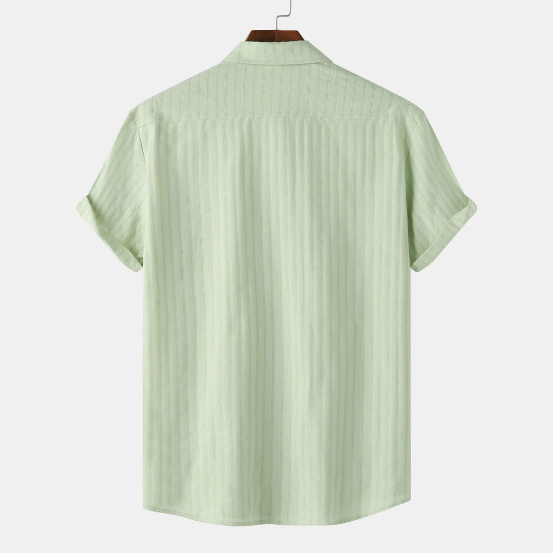 Casual men's short sleeve collared shirt. Button-down design offers comfort & smart casual style.