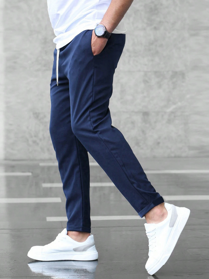 Modern slim-fit work pants for men, durable and versatile for the office or smart casual events.