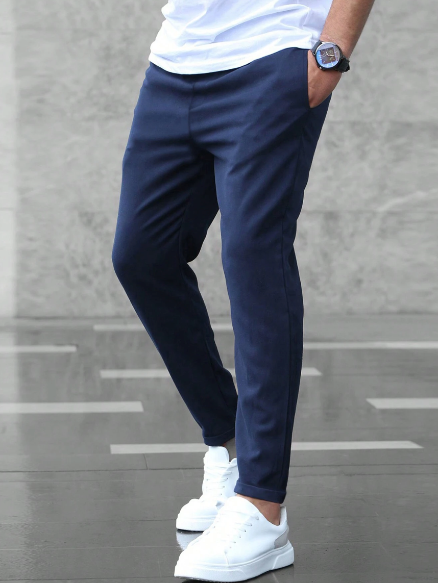 Versatile men's casual trousers, slim fit with flexible comfort for daily wear and modern style.