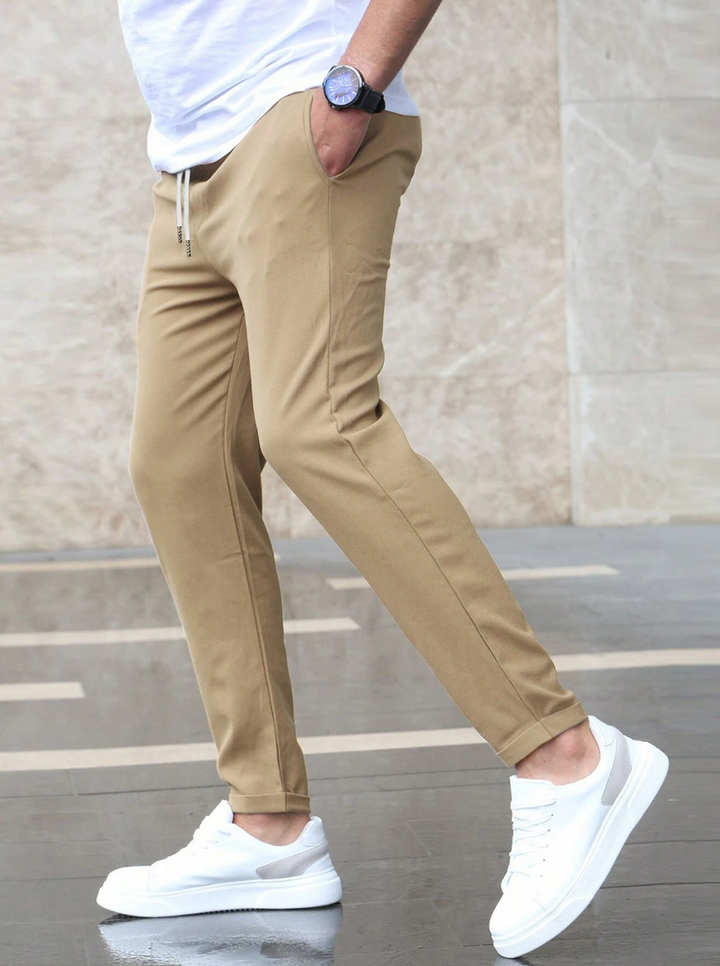 Men's durable slim-fit pants, showing flexible movement, perfect for active work and casual days.
