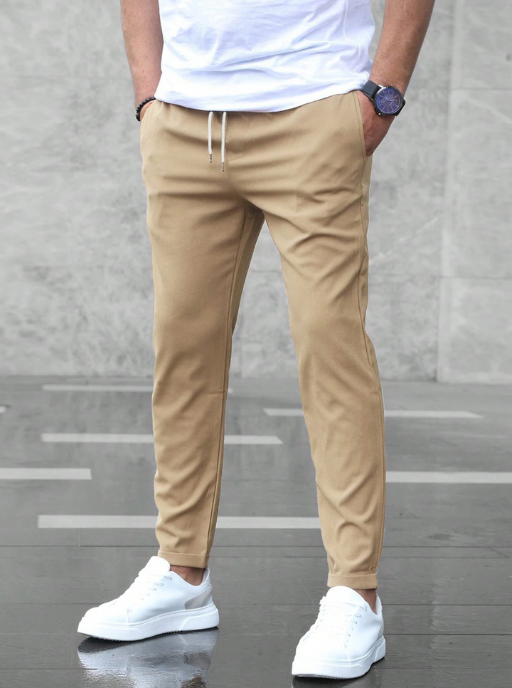 Easy care men's slim-fit business casual pants, offering flexible comfort and modern style.