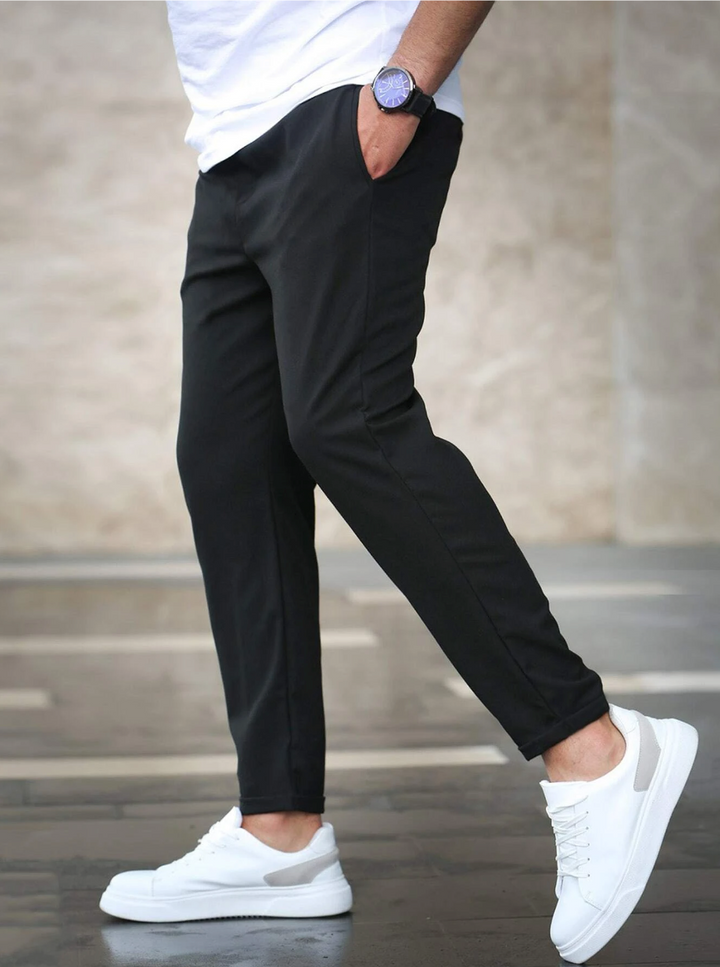 Front view of men's slim-fit flexible pants, great for work, business casual, or stylish outfits.
