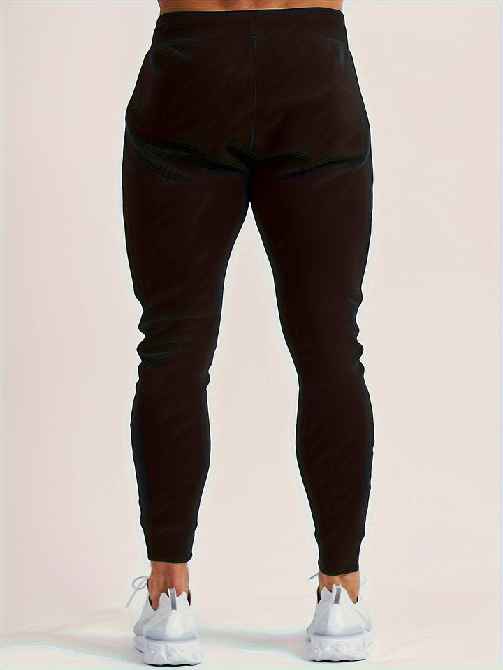 Essential men's slim fit joggers, combining athletic functionality & trend.