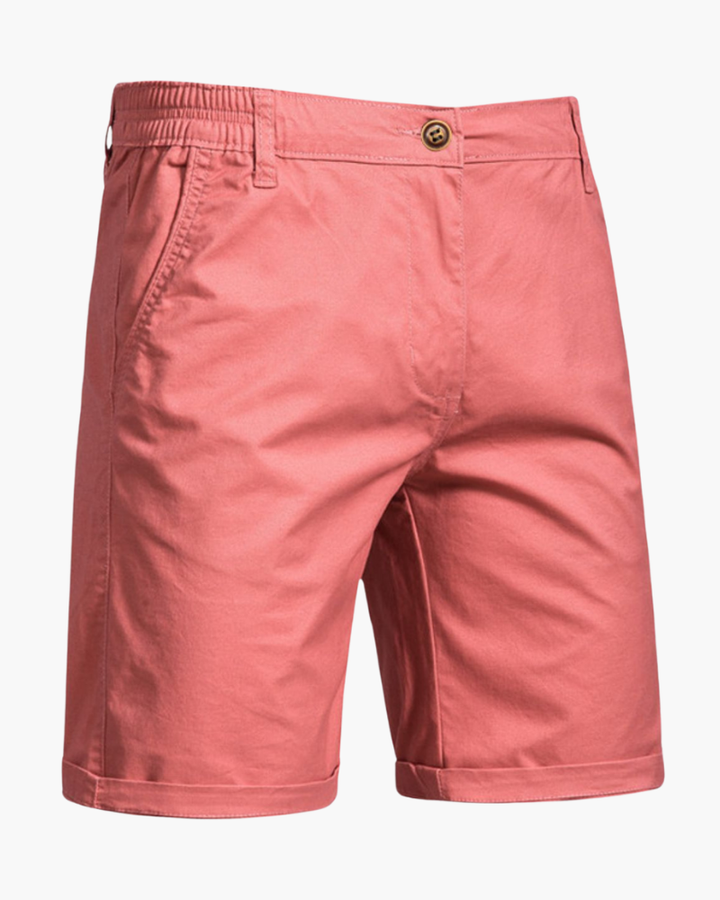 Refined hemline of men's tailored chino shorts, adding a smart casual touch for versatile summer & warm weather apparel.