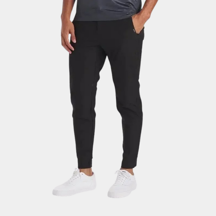 Durable men's active stretch pants, featuring wind-resistant and water-repellent fabric for all activities.