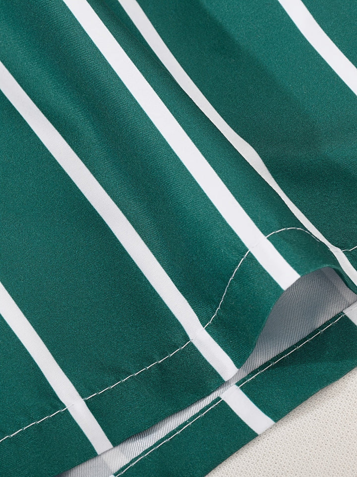Modern men's striped swim shorts with a practical drawstring for a perfect fit. Stylish summer beachwear.