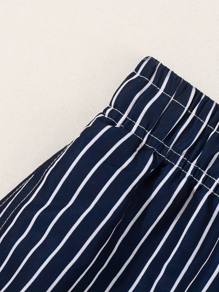 Vibrant striped men's swim shorts with drawstring. Essential mens swimwear for summer holidays.