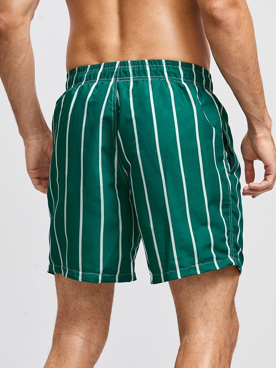 Summer-ready men's striped swim shorts, featuring a drawstring waist. Essential for mens beachwear.