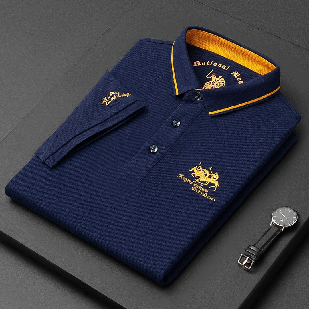 Detailed close-up of the intricate embroidery on a men's stylish short sleeve polo shirt. Modern classic design.