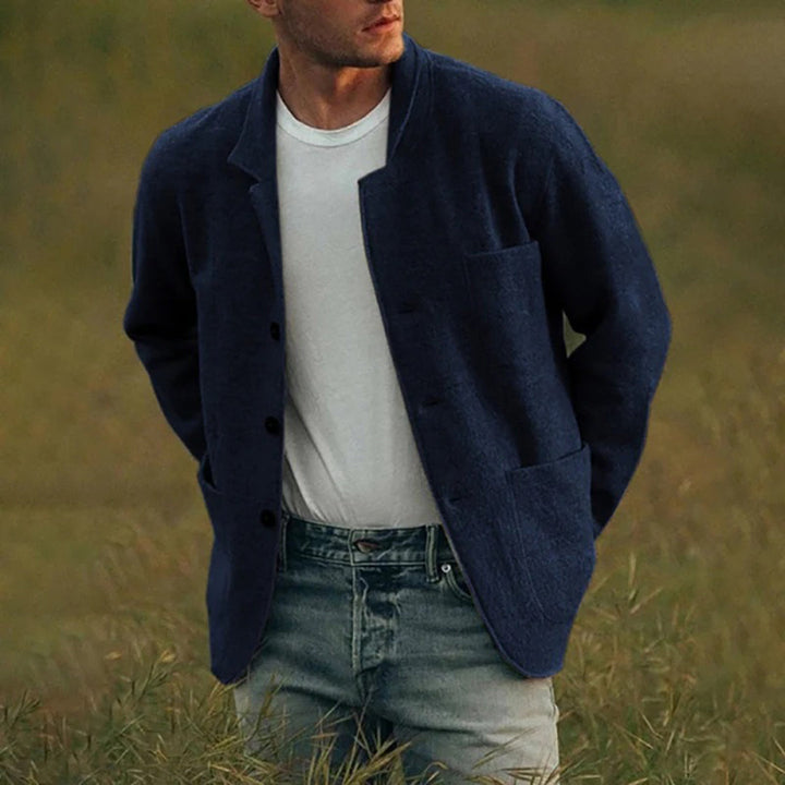 Detailed men's button-up cardigan featuring a modern notched lapel, multiple patch pockets, and a comfortable texture.