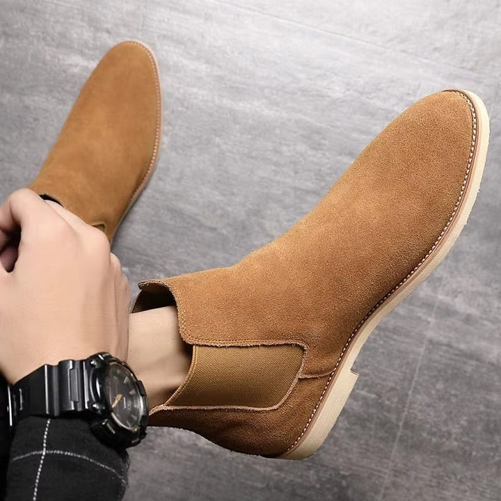 Easy slip-on men's Chelsea ankle boots, versatile for casual, office, or dress occasions with a low heel.