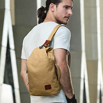 Men's water-resistant canvas crossbody bag with anti-theft pocket, ideal for daily use & travel.