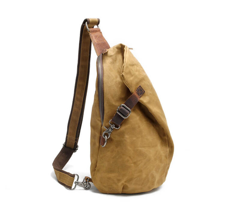 Lightweight men's sling bag, water-resistant canvas, multiple compartments including a secure anti-theft pocket.