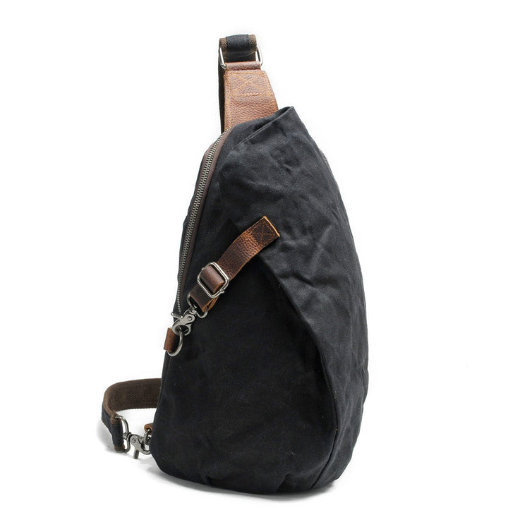 Stylish men's travel crossbody bag, water-resistant canvas, with discreet anti-theft pocket for security.
