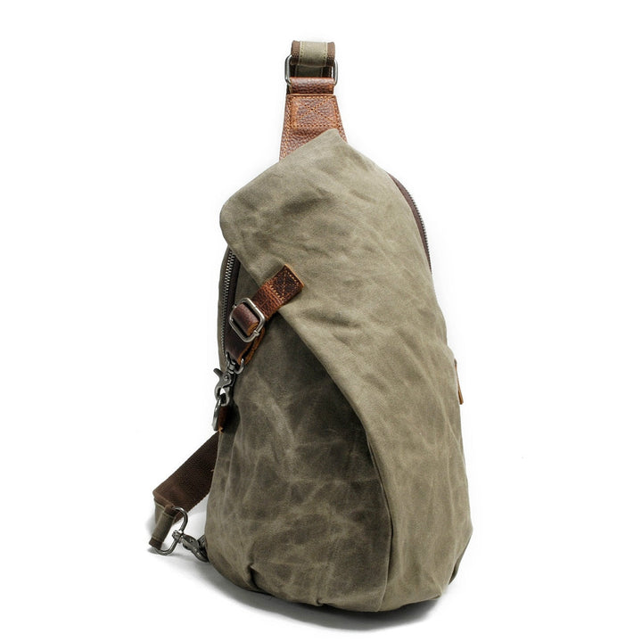 Secure men's water-resistant crossbody bag, canvas construction with a hidden anti-theft pocket for safety.