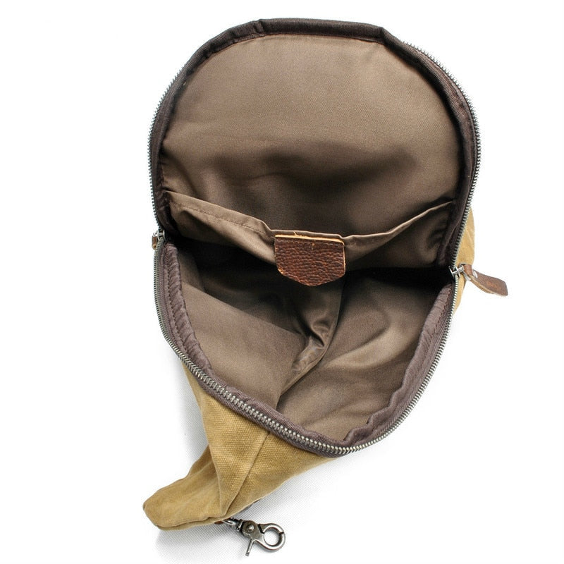 Practical men's canvas travel bag, water-resistant & anti-theft, can be worn as crossbody or sling.