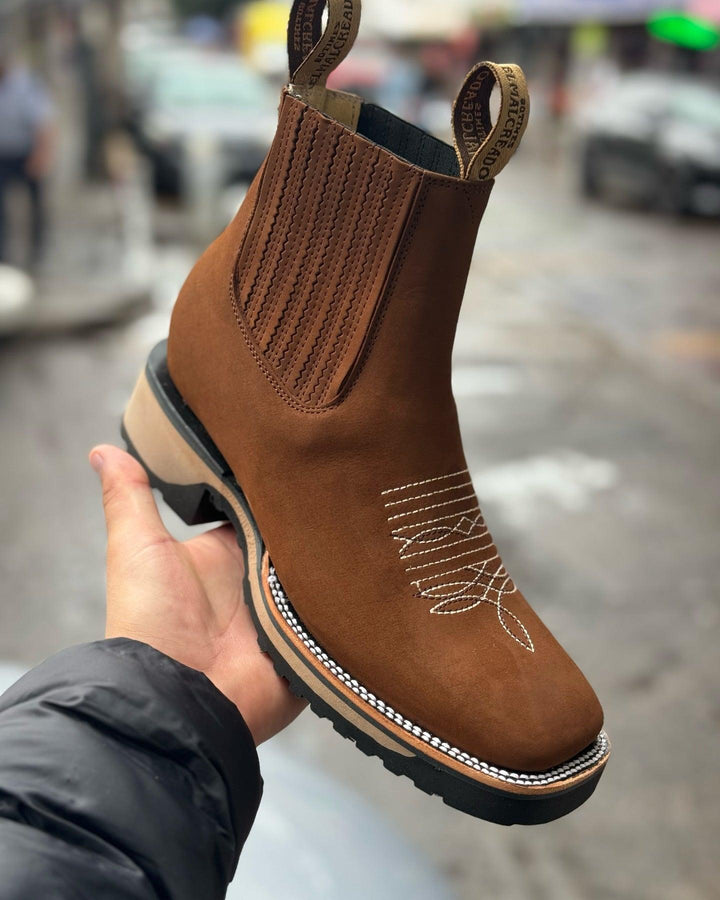 Stylish men's cowboy boots featuring detailed embroidery, squared toe, and practical elastic sides. Perfect for casual wear.