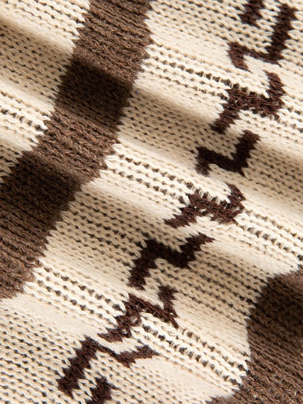 Soft knit men's zip cardigan with bold geometric pattern, designed for comfort and a contemporary fit.